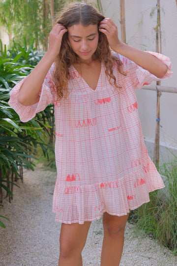 Presenting the Cuban Dress, a vibrant red mini dress created in collaboration with Audrey E Leary and World of Crow. Made from soft, breathable jamdani fabric and handwoven cotton, it combines comfort with stylish red motifs, perfect for everyday wear.