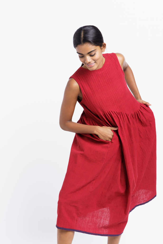 Red pleated midi dress, responsible clothing brands, sustainable India clothing brands, India made organic clothing, best organic and sustainable clothing brands, cotton clothing store near me, lightweight cotton women's clothing, cotton on women's pants, earthy women's clothes, minimalist clothing list women's, minimalist dress